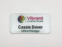 Printed white metal name tag with clear domed Tag Armor