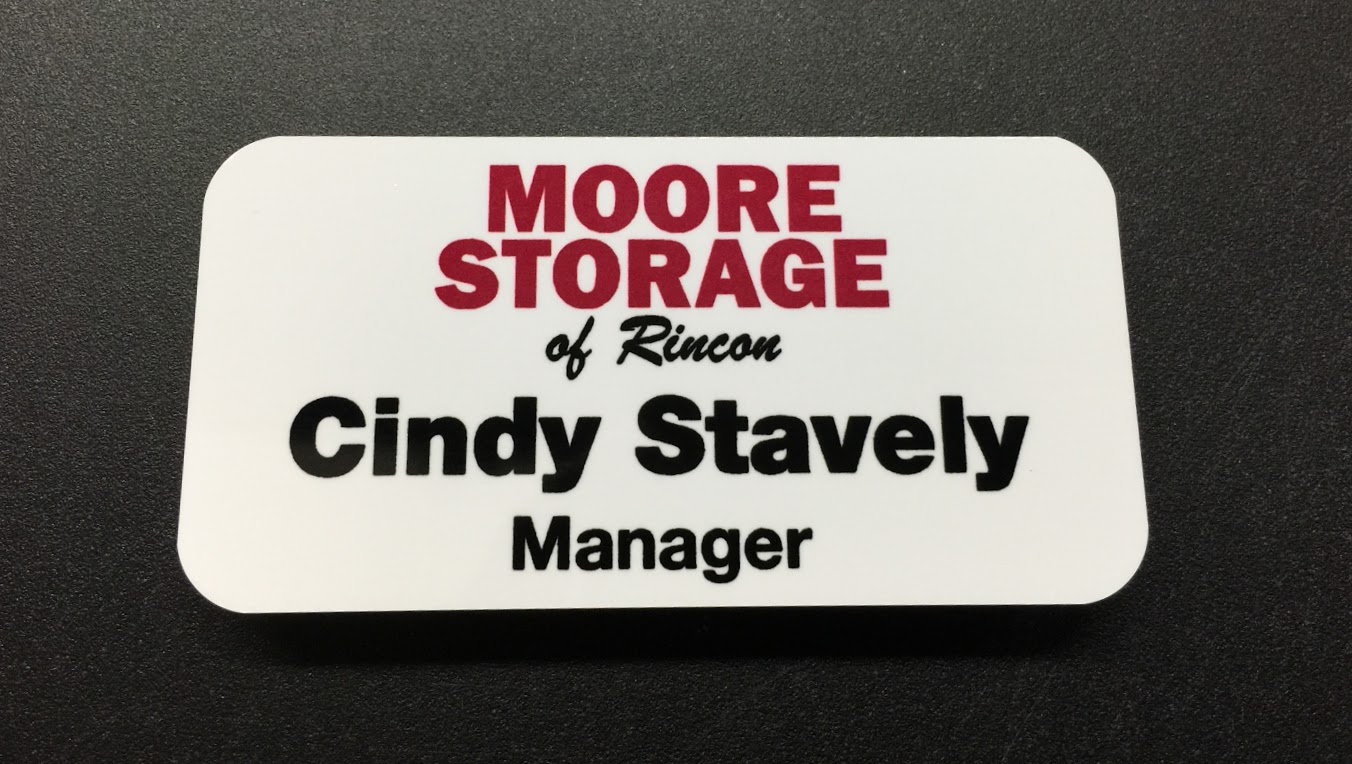 White metal nametag. Design for Moore Storage of Rincon.