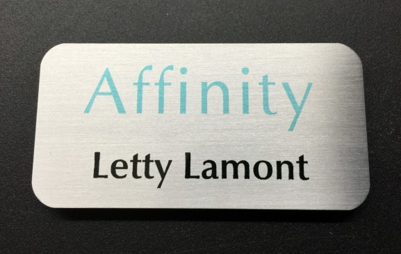 Brushed silver metal nametag. Design for Affinity.