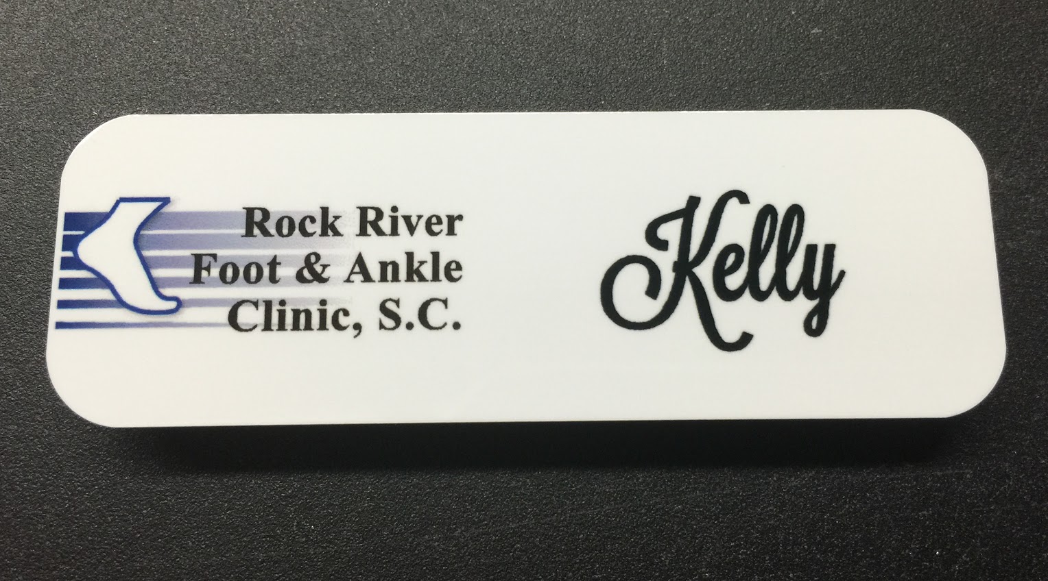 White metal nametag. Design for Rock River Foot & Ankle Clinic.