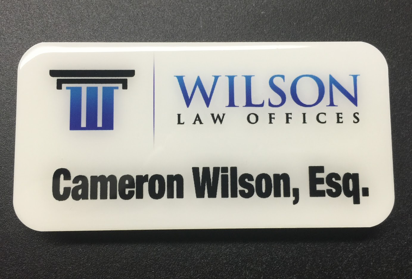 White metal nametag. Design for Wilson Law Offices.
