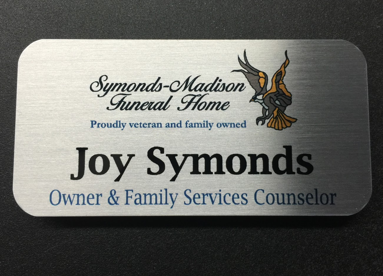 Brushed silver metal nametag. Design for Symonds-Madison Funeral Home.
