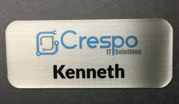 Brushed silver metal nametag. Design for Crespo IT Solutions.