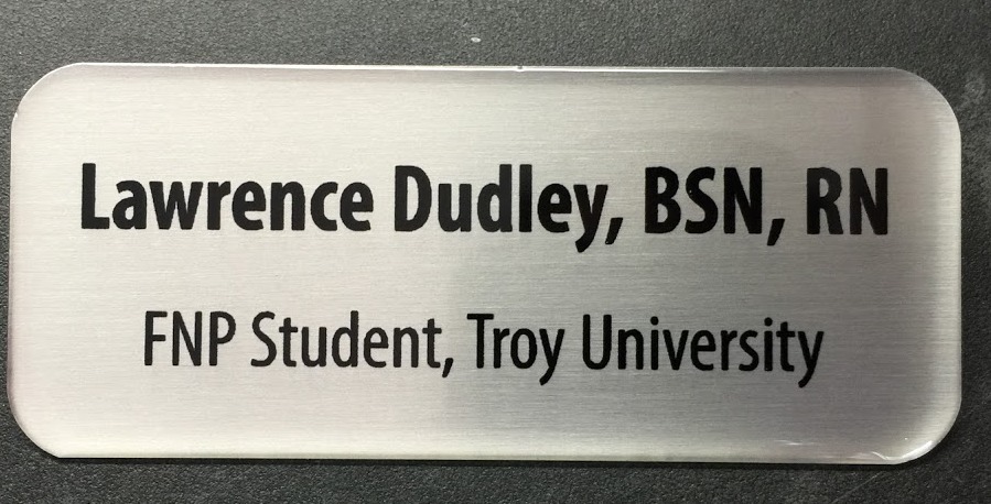 Brushed silver nametag, with epoxy coating. Design for Troy University.