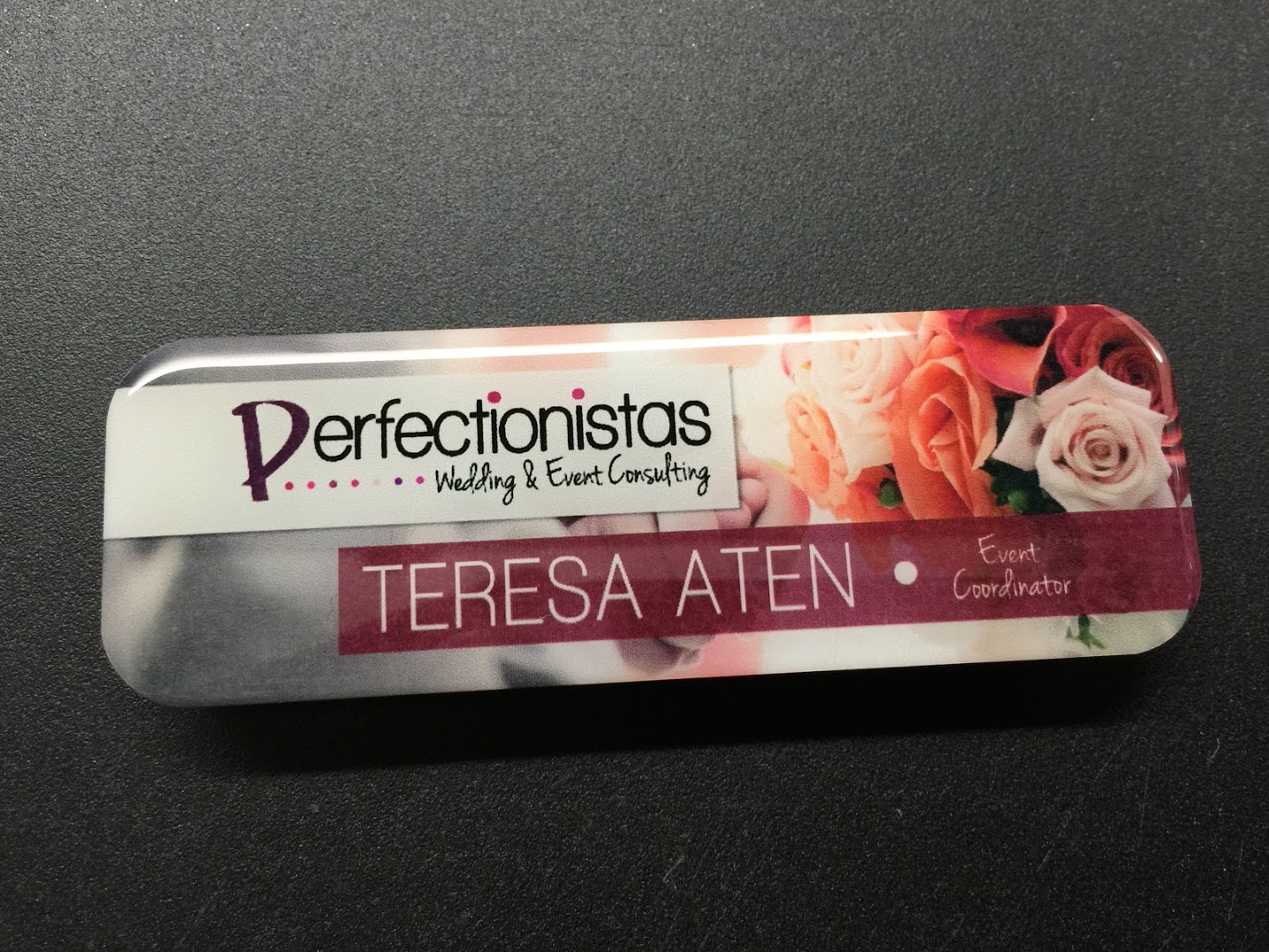 Custom white metal nametag. Design for Perfectionistas - Wedding & Event Consulting