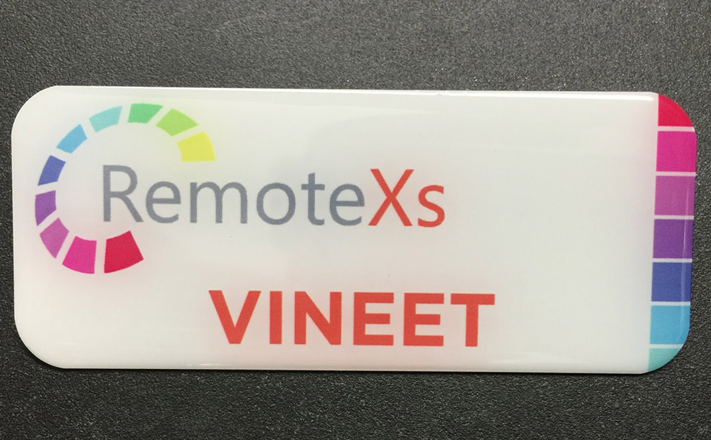 White metal nametag with epoxy coating. Design for RemoteXs.