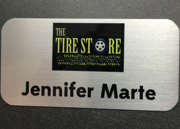Brushed silver nametag. Design for The Tire Store.