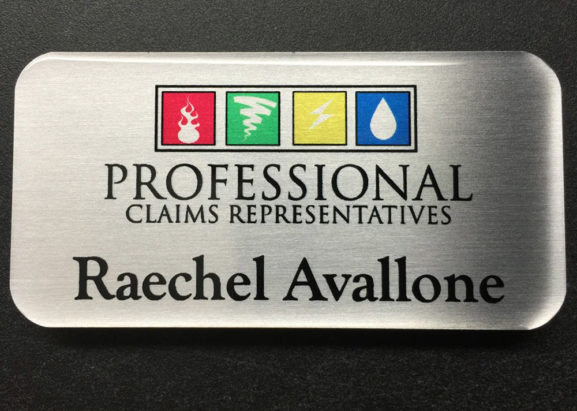Custom brushed silver name badge. Design for Professional Claims Representatives.