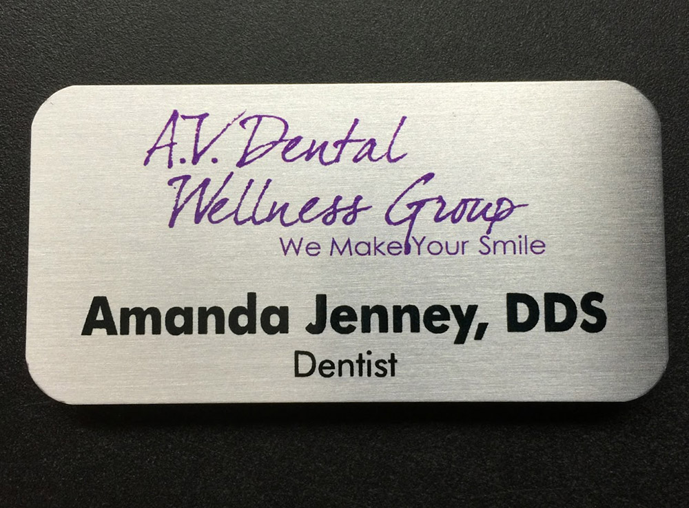Custom brushed gold name badge. Design for A.V. Dental Wellness Group.