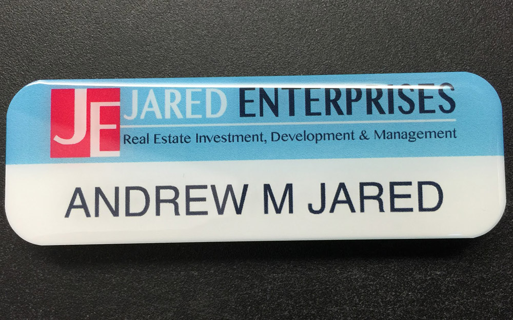 Custom white nametag. Design for Jared Enterprises.