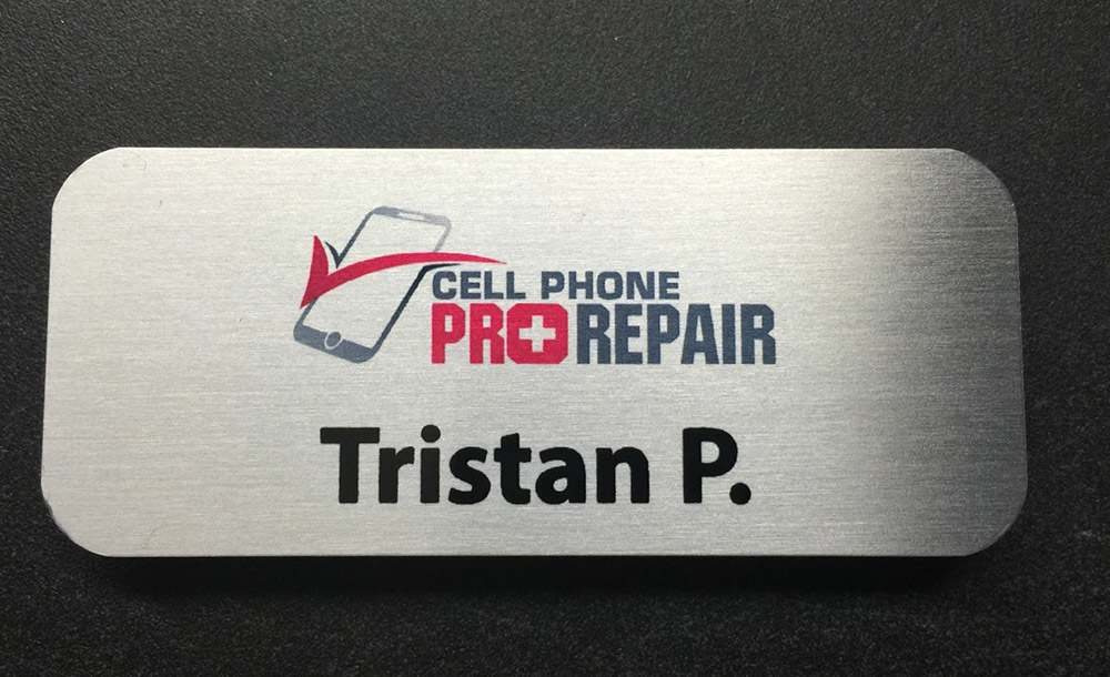 Custom brushed silver name badge. Design for Cell Phone Pro Repair.